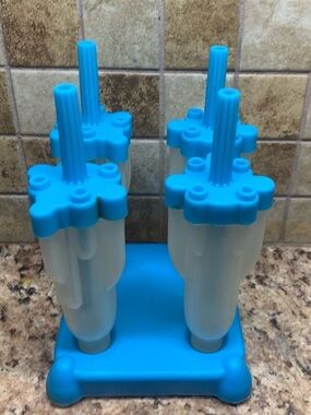 Rocket Pop Mold set with a blue base and Four rocket-shaped molds. Popsicle Mold